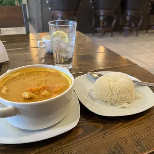 a bowl of curry and a plate of rice