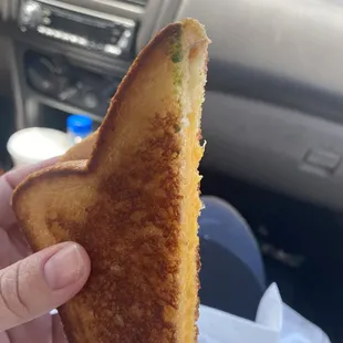 Never asked for a grilled cheese with avocado . At this point they just didn't even care to clean their knives so gross .