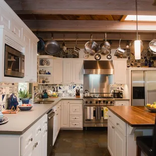 2019 Kitchen remodel - new drawer &amp; door fronts, new Italian faux concrete counter-top to coordinate with existing slate floor.