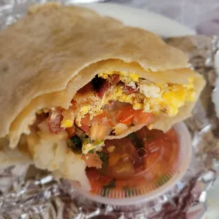 Omggggg sooo good! Bacon breakfast burrito with egg, hashbrowns and pico.