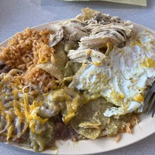 Chilaquiles verdes with chicken and eggs