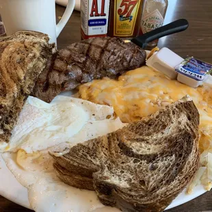 Sirloin and Eggs, cheesy hash browns and marble rye toast.