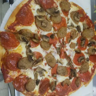 Pepperoni, sausage, mushroom pizza