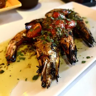 a plate of grilled shrimp