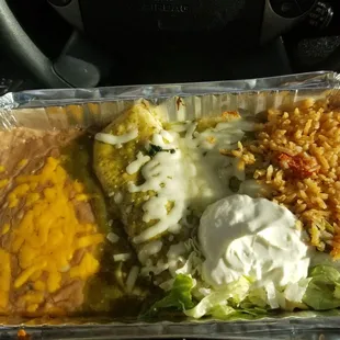 Spinach enchiladas with refried beans and spanish rice