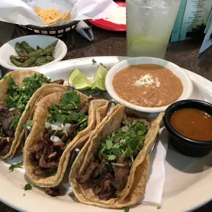 Street Tacos (carne asada) with refried beans and grilled jalepenos with fresh squeezed lime.