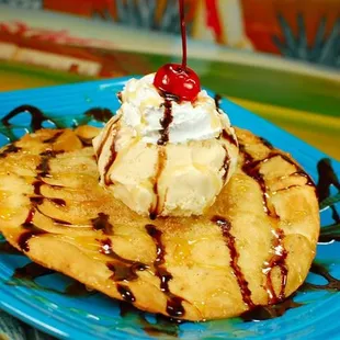 a banana split with ice cream and chocolate syrup