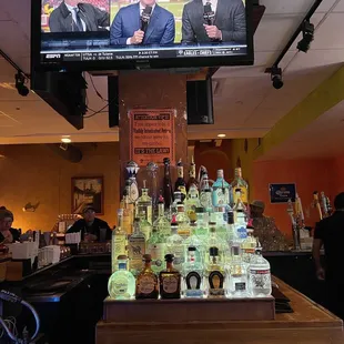 a bar with liquor bottles on the bar