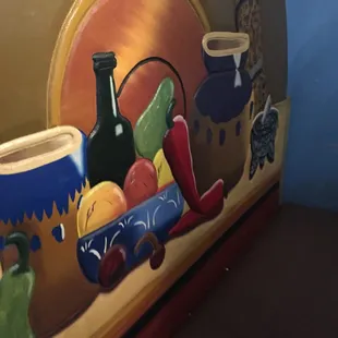 The booths all have pictures painted on them.