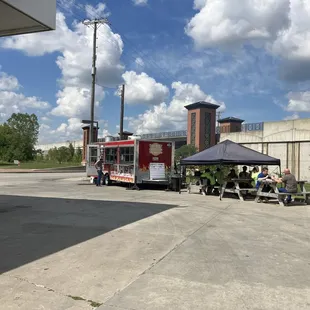 Limited seating available-- the truck is on the far side of the gas station
