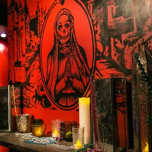 a table with candles and beads