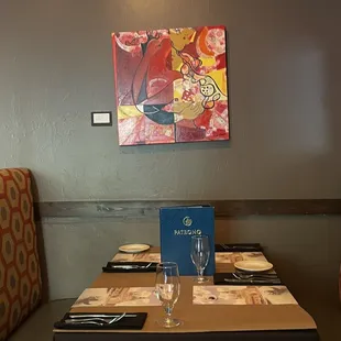 a restaurant table with place settings