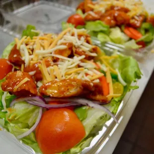a salad in a plastic container