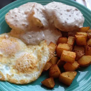 Biscuits and Gravy, over medium eggs and potatoes.