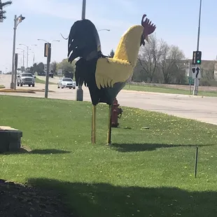 a rooster on a pole