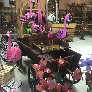 pink flamingos in a wagon