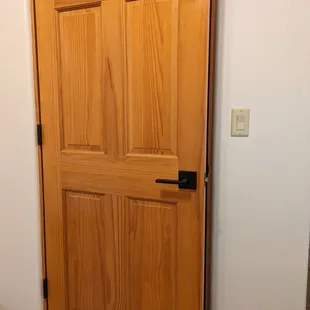 Tony re-finished old pine doors and installed new flat black hardware