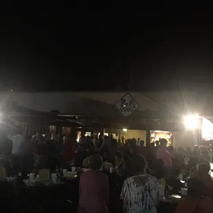 a large group of people sitting at tables