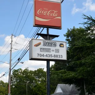 a sign for malcolm's coca cola