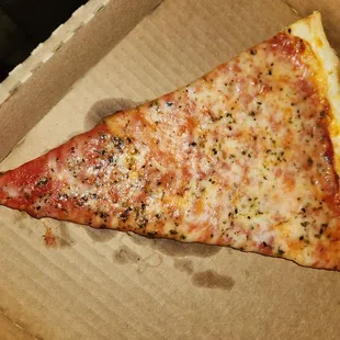 a slice of pizza in a box