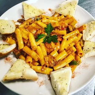 a plate of pasta and bread
