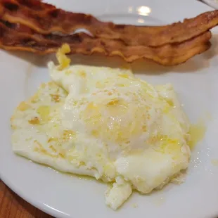 a plate of eggs and bacon