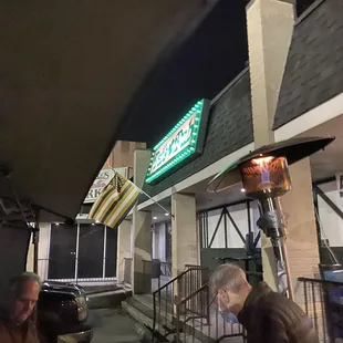 the front of the restaurant at night