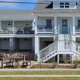 a two story house with a balcony