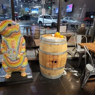 a wooden barrel with a painted rabbit on it