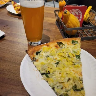 Grab a yummy slice of pizza  at Boss Lady next door to enjoy with your beer