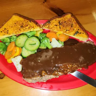 Tuesday Meatloaf is so good it&apos;s available the rest of the week. Tender meatloaf along with steamed vegetables and toast.