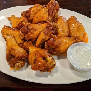 a plate of chicken wings