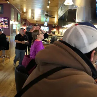 people sitting at the bar