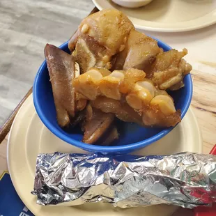 boiled pigs feet pieces (corn tortillas are in the foil wrap)