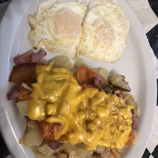 Loaded home fries with two over easy eggs