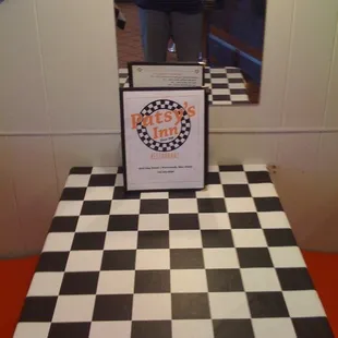 a checkered floor with a mirror