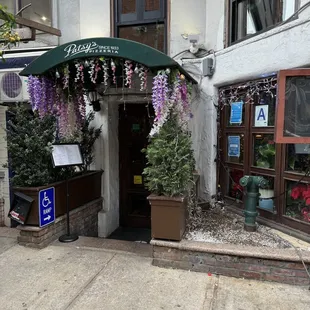 the entrance to pizzeria