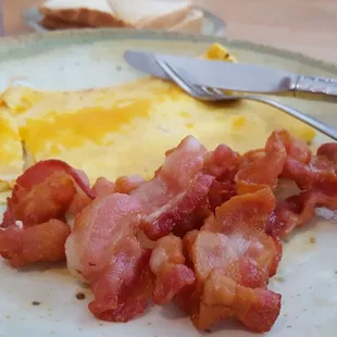 Omelette with bacon, toast.