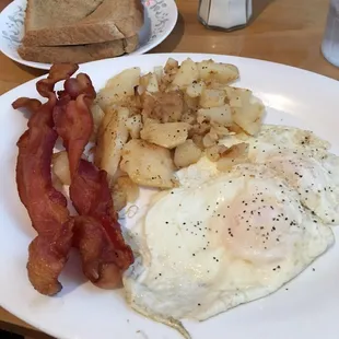Over medium eggs bacon home fries and toast! Bacon was soooo good