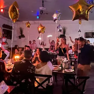 a group of people sitting around a table