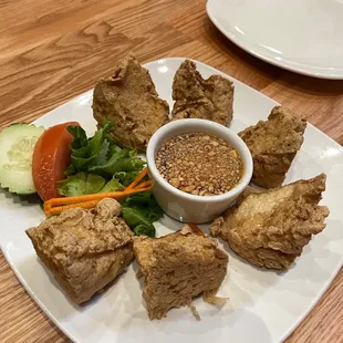 a plate of food on a wooden table