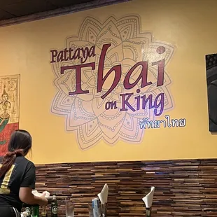 a woman standing in a restaurant