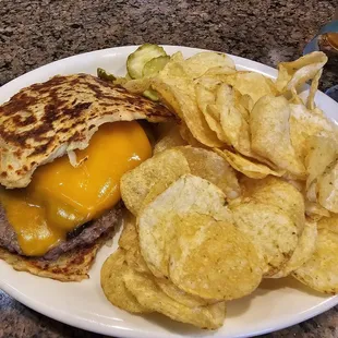 Patterson&apos;s Irish burger with cheddar and a side of potato chips. Plenty to eat.