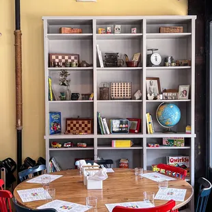 a round table with red chairs