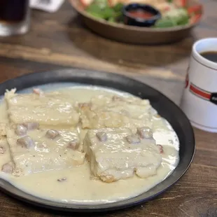 a plate of food and a cup of coffee