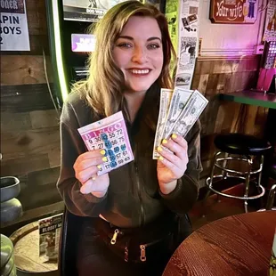 a woman holding a lot of money