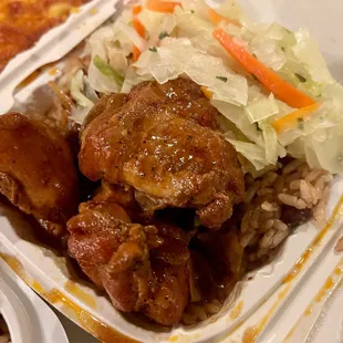 Stew Chicken over rice and peas with a side of cabbage