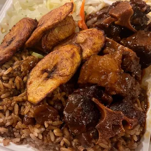 Oxtails over rice and peas, Plantains, cabbage