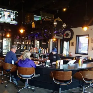 people sitting at a bar