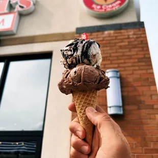 Zanzibar Chocolate and Moose Tracks ice cream in front of shop.